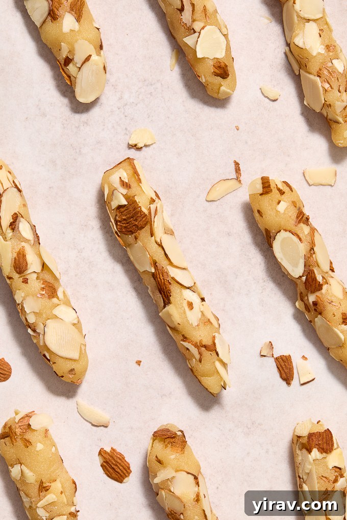 Almond horn cookies rolled into logs with almonds.