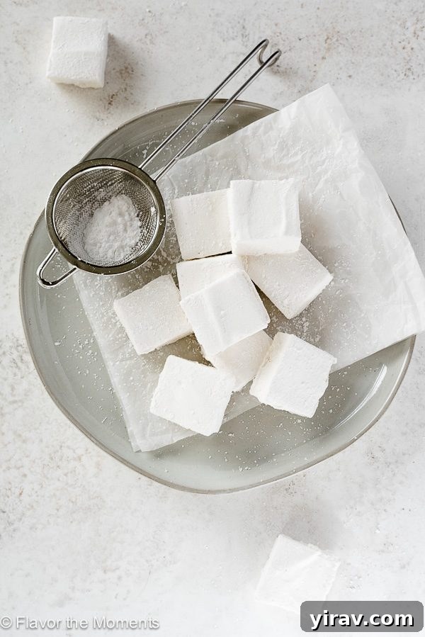Homemade marshmallows on a plate with sieve