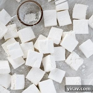 Homemade marshmallows scattered on waxed paper
