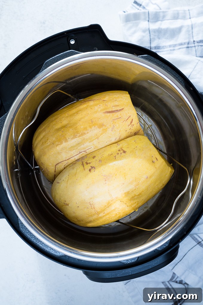 Halved spaghetti squash placed in an Instant Pot