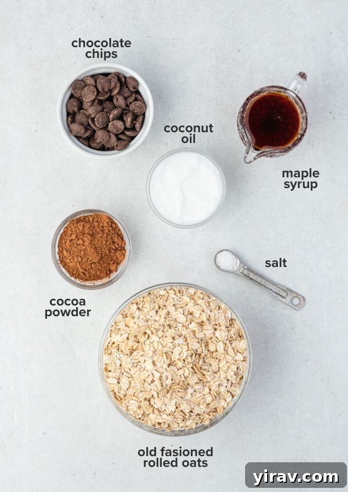 Individual ingredients for homemade chocolate granola laid out