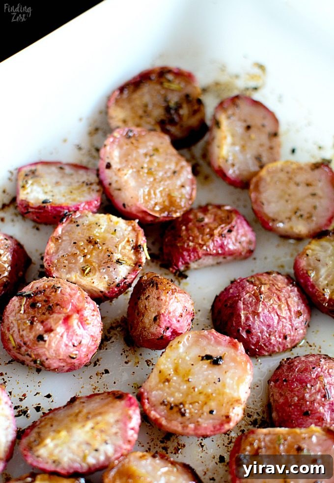 Roasted radishes on a white plate, showcasing their tender, mellowed form.