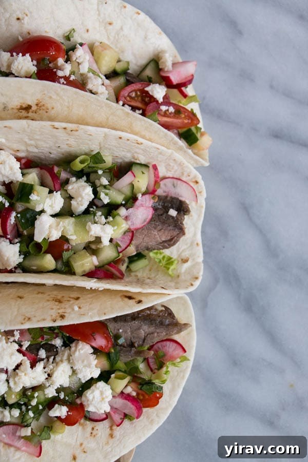 Three steak tacos with radish slaw, a perfect blend of flavors and textures.