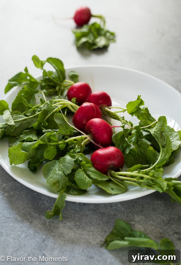 Radishes on a round white plate, showcasing their fresh appearance.