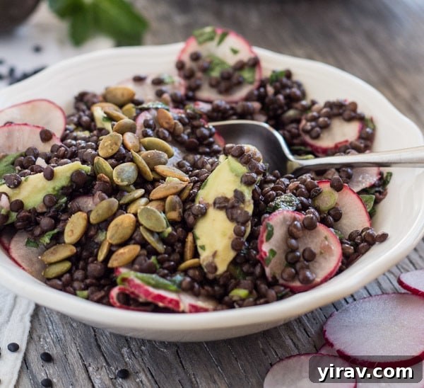 Lentil radish salad in a white bowl, a hearty and healthy option.