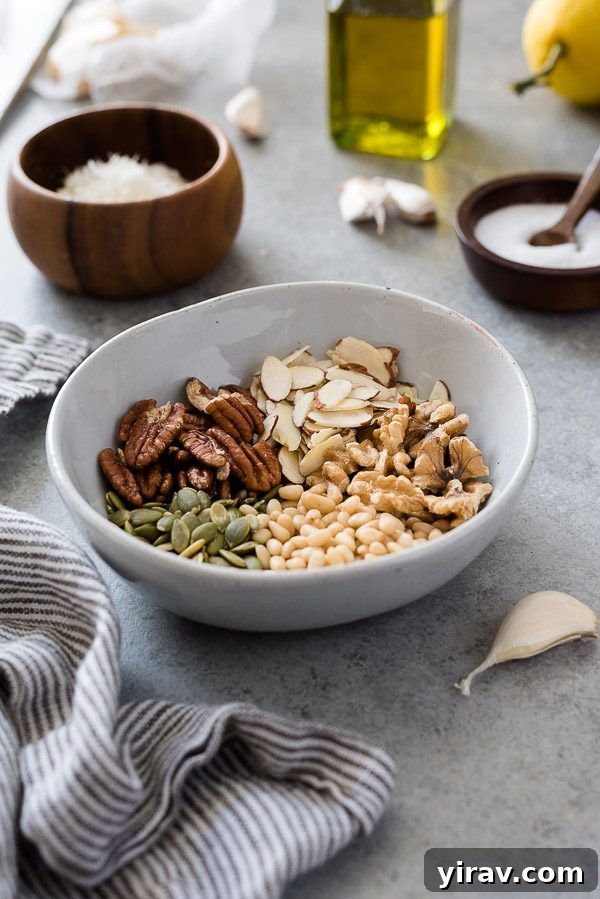A rustic bowl filled with a colorful assortment of nuts and seeds, highlighting the variety that can be used in pesto.