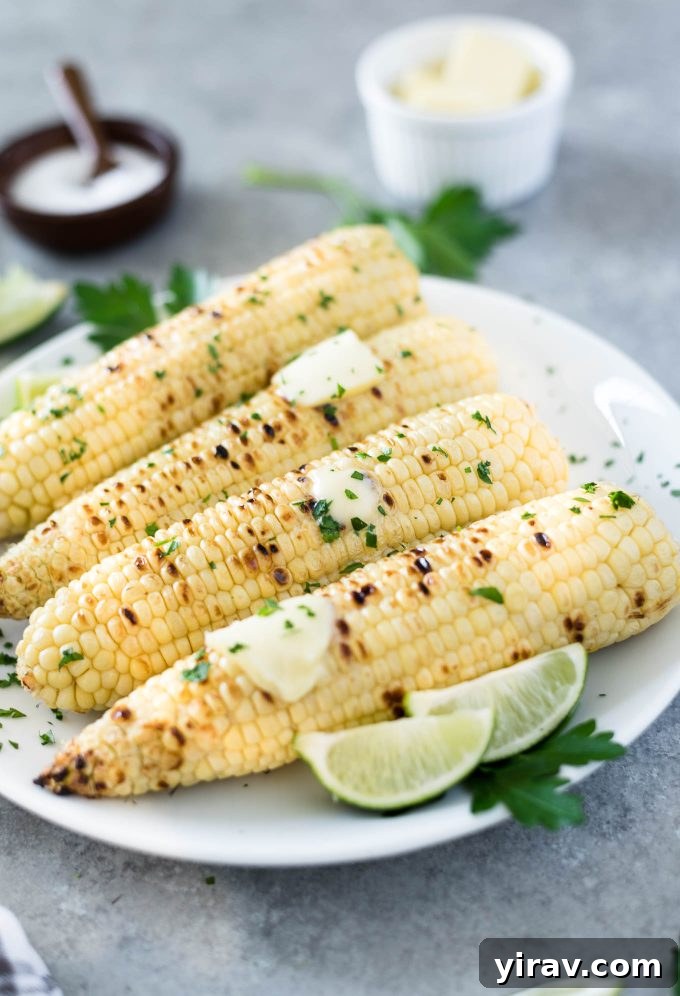 Grilled corn on the cob with butter and lime