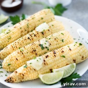 Grilled corn on the cob with butter and lime