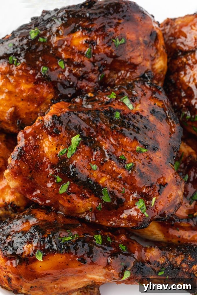 Grilled bbq chicken on a platter with parsley