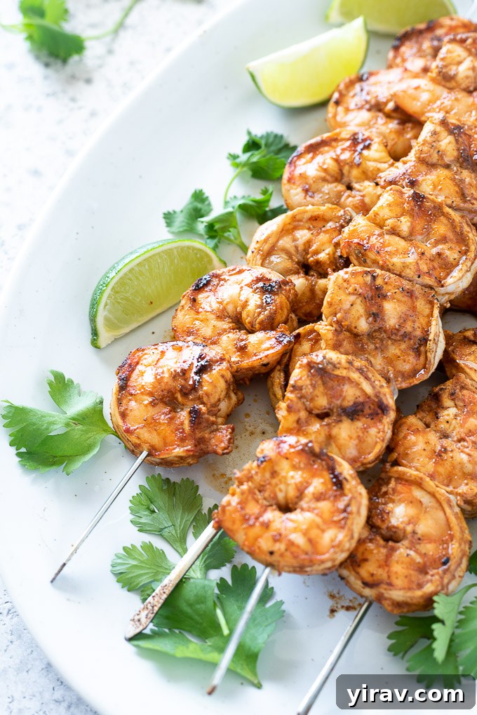 Chili lime shrimp on a platter with lime and cilantro