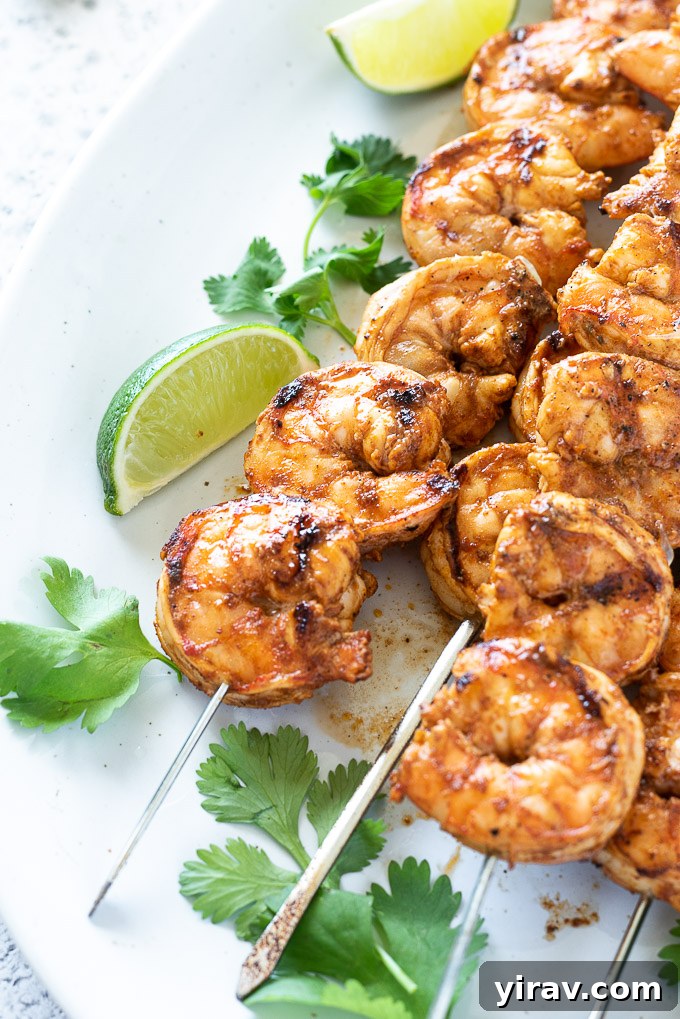 Grilled shrimp on skewers with lime and cilantro