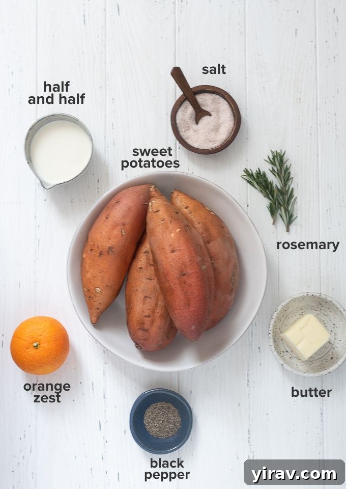 A selection of fresh ingredients for mashed sweet potatoes, including sweet potatoes, half and half, butter, orange, and rosemary.