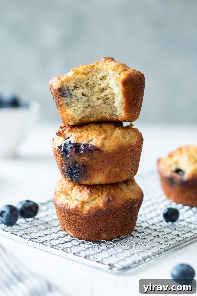Stack of almond flour banana muffins with blueberries