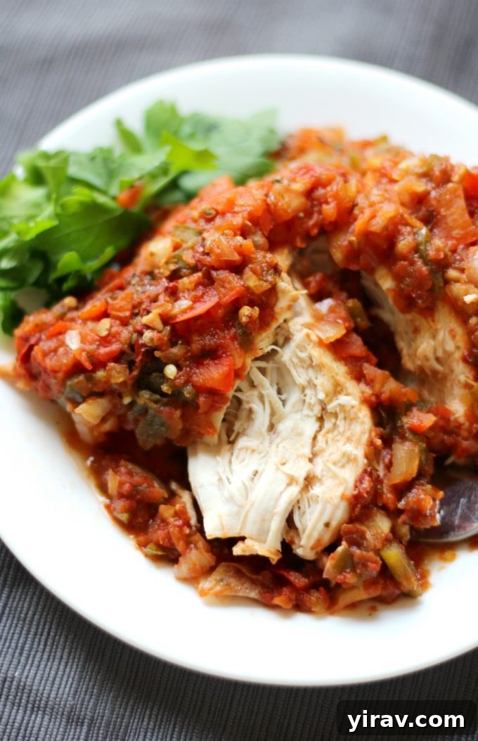 A vibrant and savory Slow Cooker Chicken Sofrito dish, garnished and ready to be served.