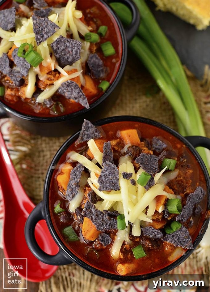 Hearty bowl of Sweet Potato, Poblano and Chorizo Chili, garnished and ready for a warming meal.