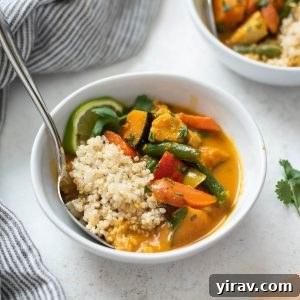Creamy Thai Pumpkin Chicken Curry 9 Thai pumpkin curry in a bowl with spoon buried inside