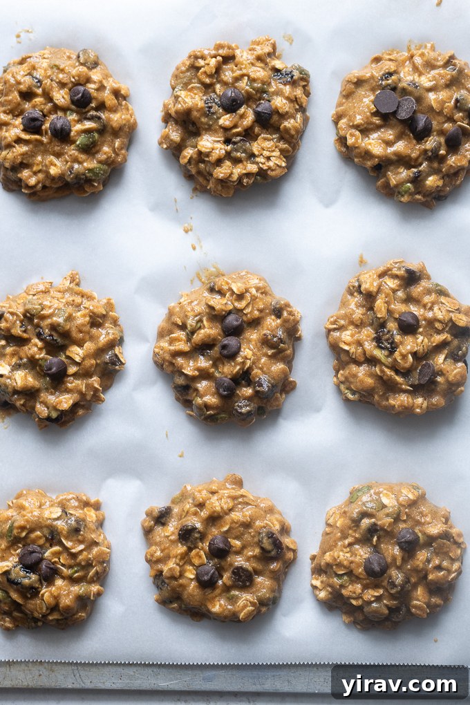 Pumpkin Spice Sunrise Bites 6 Pumpkin breakfast cookies dough scooped onto a baking sheet before baking.