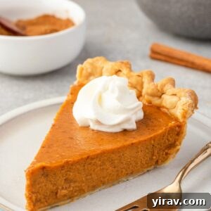Perfect Homemade Pumpkin Pie 9 Slice of pumpkin pie from scratch on a plate with whipped cream