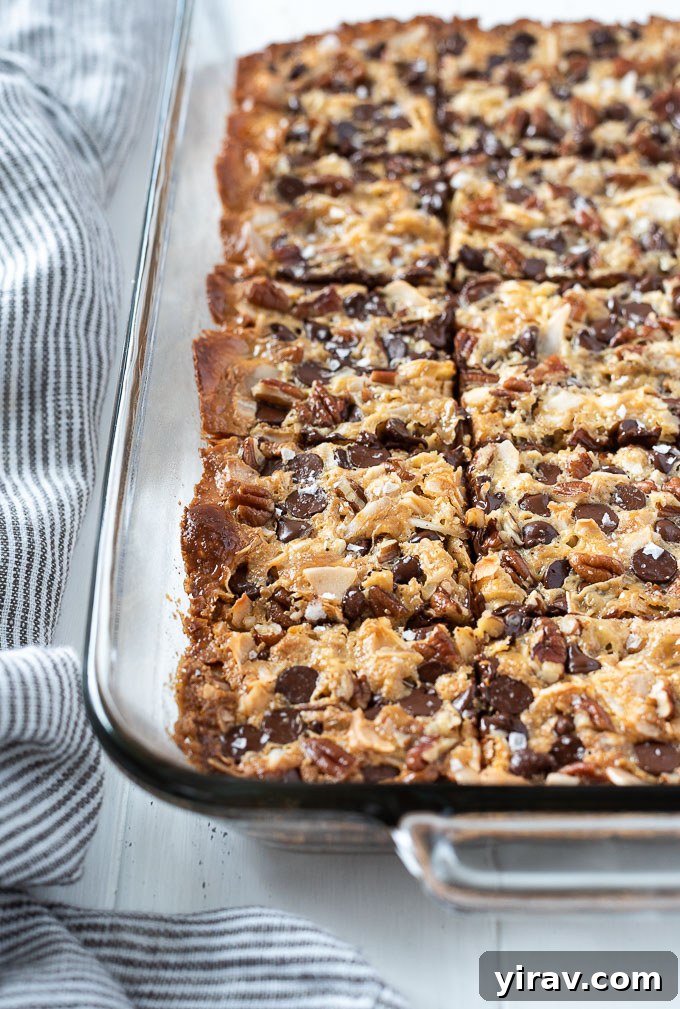 Seven layer bars in a baking dish, freshly cut into squares.