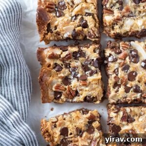 Magic cookie bars cut into squares, ready to be eaten.