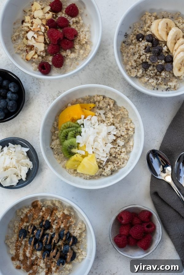 Tropical quinoa oatmeal breakfast bowls garnished with fresh pineapple, papaya, and kiwi, inviting healthy eating.
