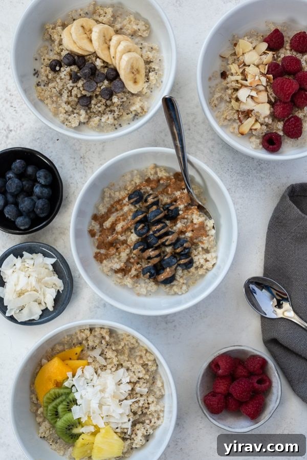 Close-up of a blueberry almond butter quinoa oatmeal breakfast bowl, showing plump blueberries and a drizzle of almond butter.