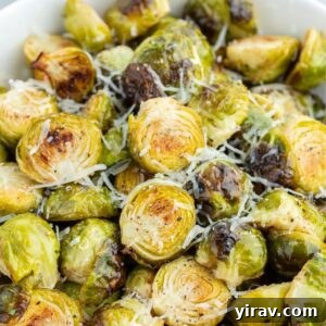 A bowl of air fryer Brussels sprouts with Parmesan cheese.