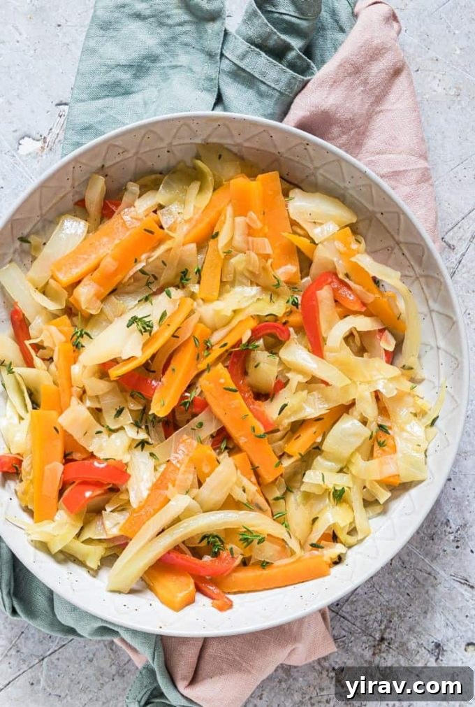 Overhead view of a delicious bowl of Jamaican cabbage, garnished and ready to serve.