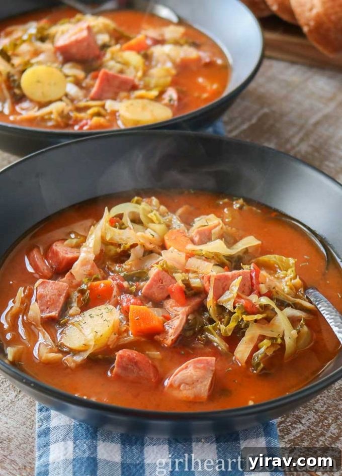 Two cozy bowls of Cabbage Soup with Sausage and Potatoes, perfect for a comforting meal.