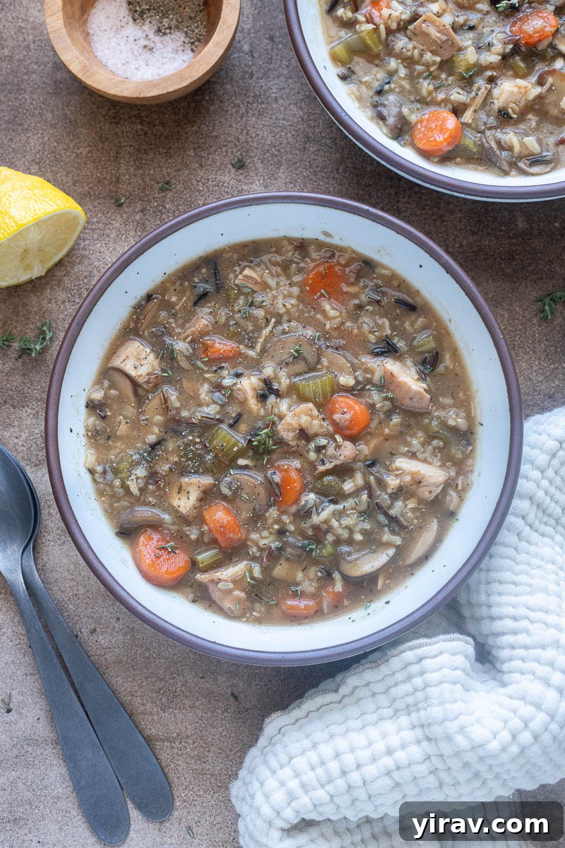Chicken wild rice soup with no cream in a bowl.