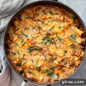 Overhead shot of skillet lasagna with chopped basil on top