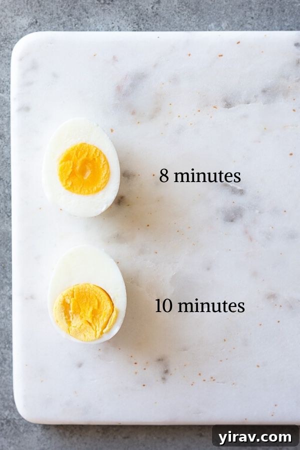 A visual guide to hard boiled egg doneness with different cooking times, showcasing various yolk textures from soft to fully cooked.
