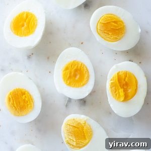 hard boiled eggs cut in half on a marble board