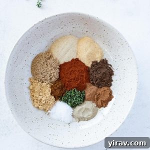Homemade Jerk Seasoning in a white bowl before blending, top-down view