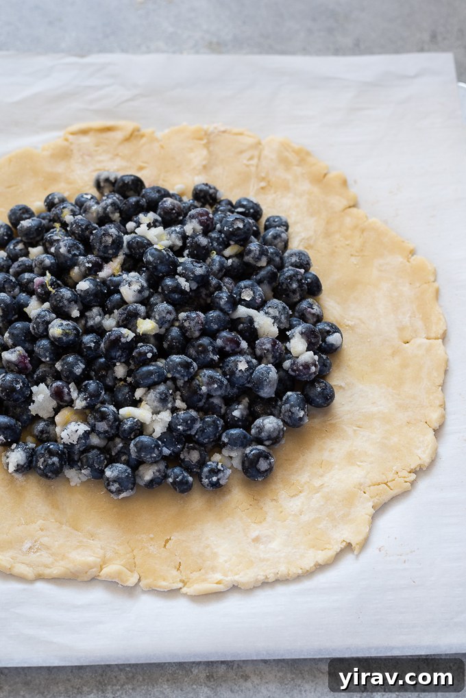 Blueberry filling in center of galette dough.