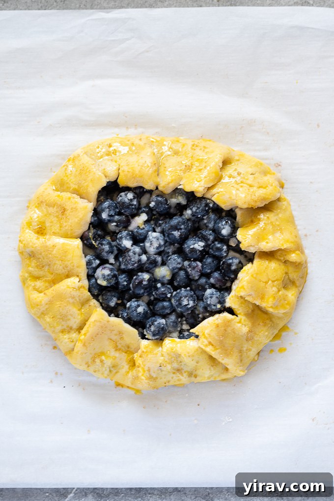 Blueberry galette before baking with egg wash.