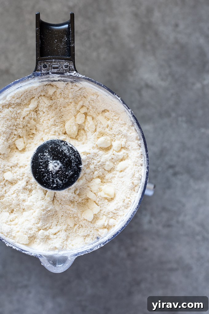 Butter incorporated into flour mixture for galette dough.