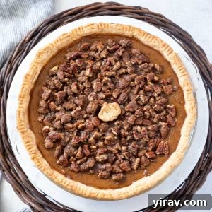Pumpkin pecan pie on a cake stand, featured in the recipe card.