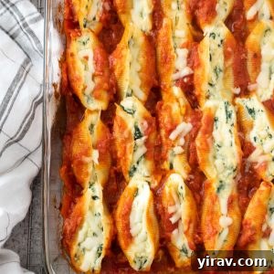 Spinach and ricotta stuffed shells in a baking dish, ready for the oven