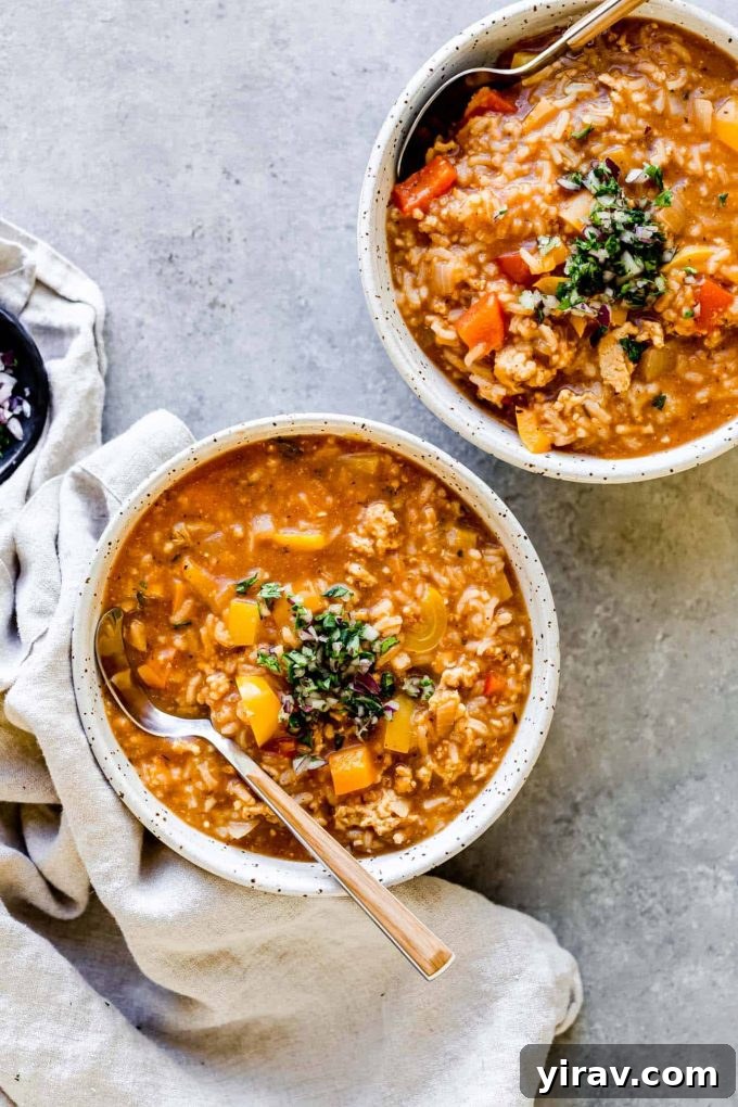 Bowls of Instant Pot Stuffed Pepper Soup with a linen