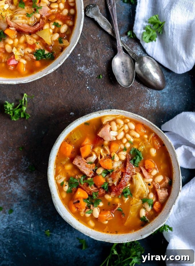 Bowls of ham and bean soup with spoons