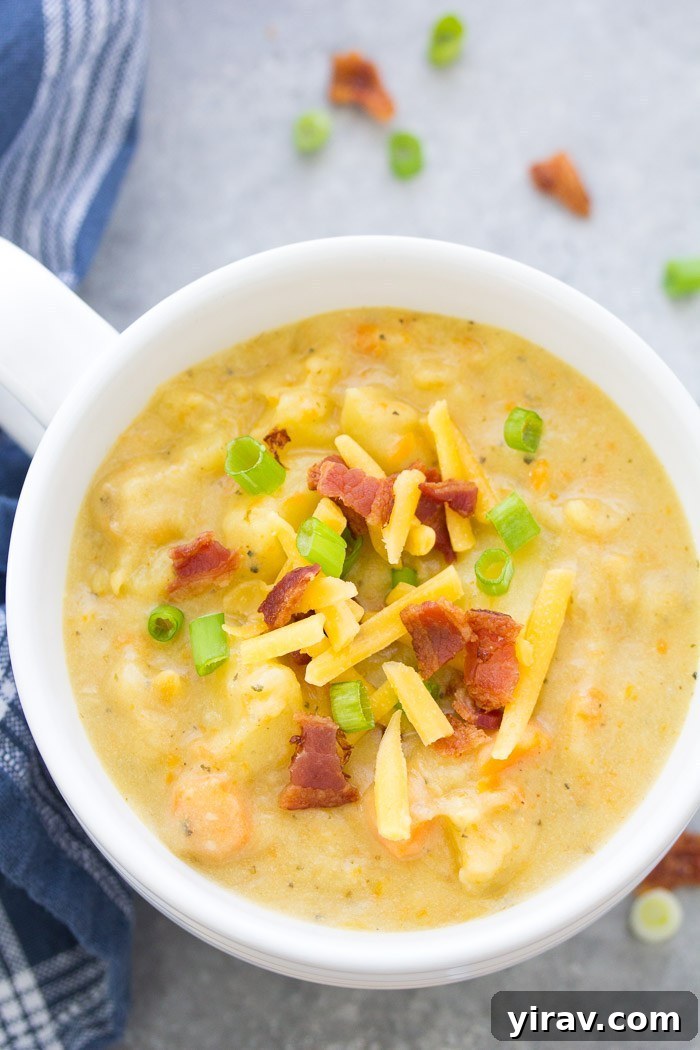 Creamy potato soup in a bowl with bacon and cheese