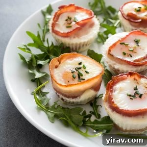 Bacon and egg muffins on a plate with arugula