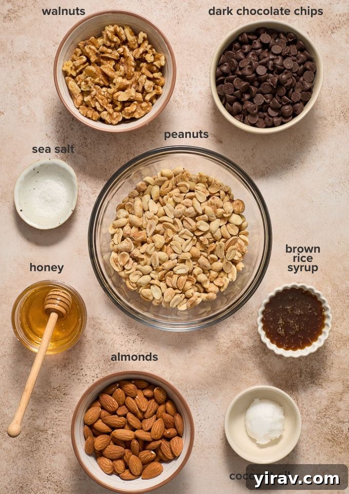 A collection of nuts, honey, brown rice syrup, and dark chocolate chips for making nut bars.