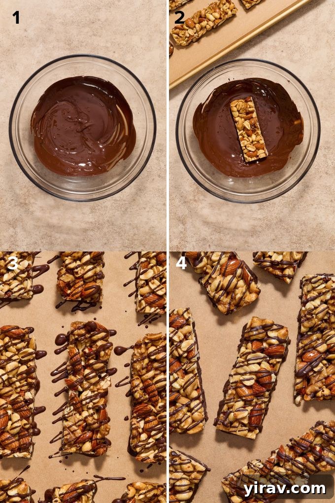 The process of dipping homemade nut bars in melted dark chocolate.