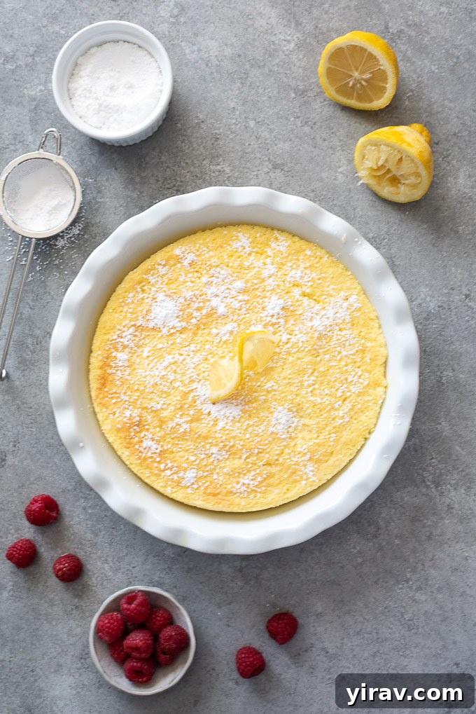 Magic Lemon Pudding Cake 3 Lemon pudding cake in baking dish with powdered sugar on top