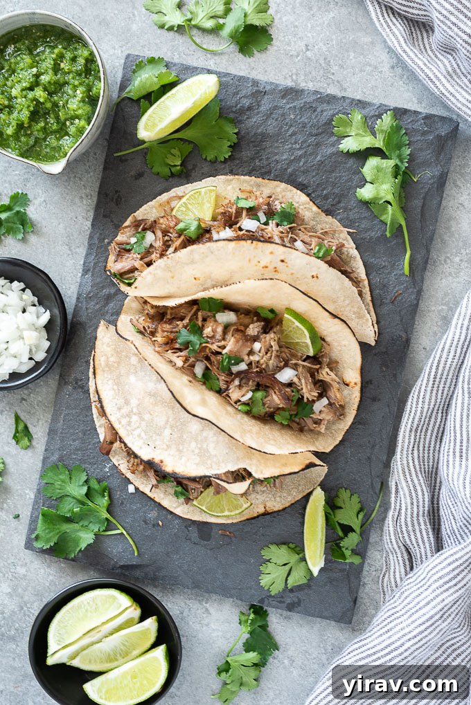 Pork carnitas tacos on a serving plate
