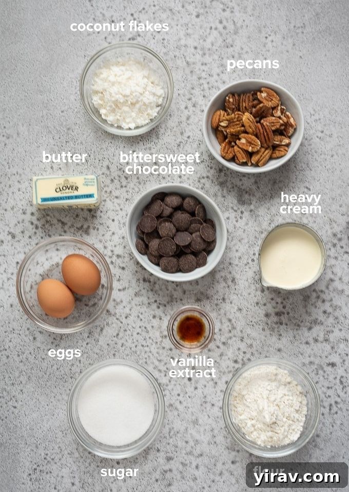 German Chocolate Cake Brownies 4 Arrangement of all ingredients needed for German chocolate brownie recipe, including chocolate, butter, eggs, flour, sugar, cream, coconut flakes, and pecans.