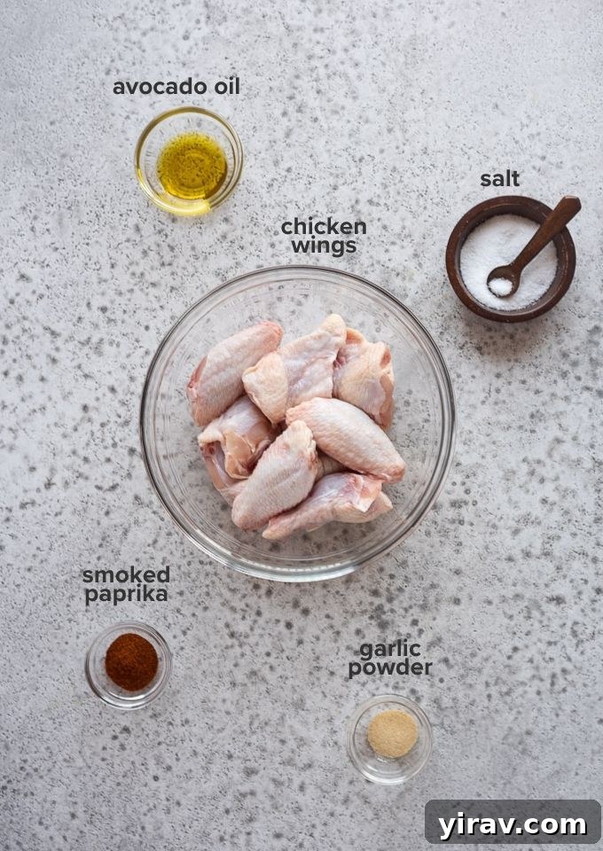Air Fryer Wings: Crispy Perfection 4 All ingredients for air fryer chicken wings laid out on a table