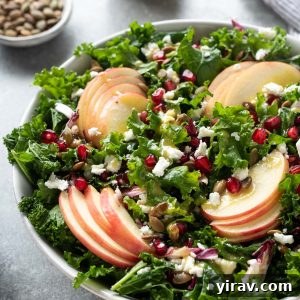 Kale apple salad with pomegranate and pepitas